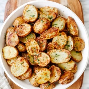 overhead view of air fryer baby potatoes in a white plate