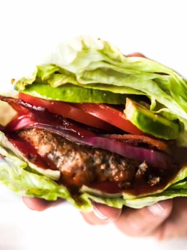 Overhead view of a hand holding a bunless burger