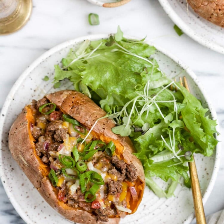 overhead view of stuffed sweet potato on a white plate