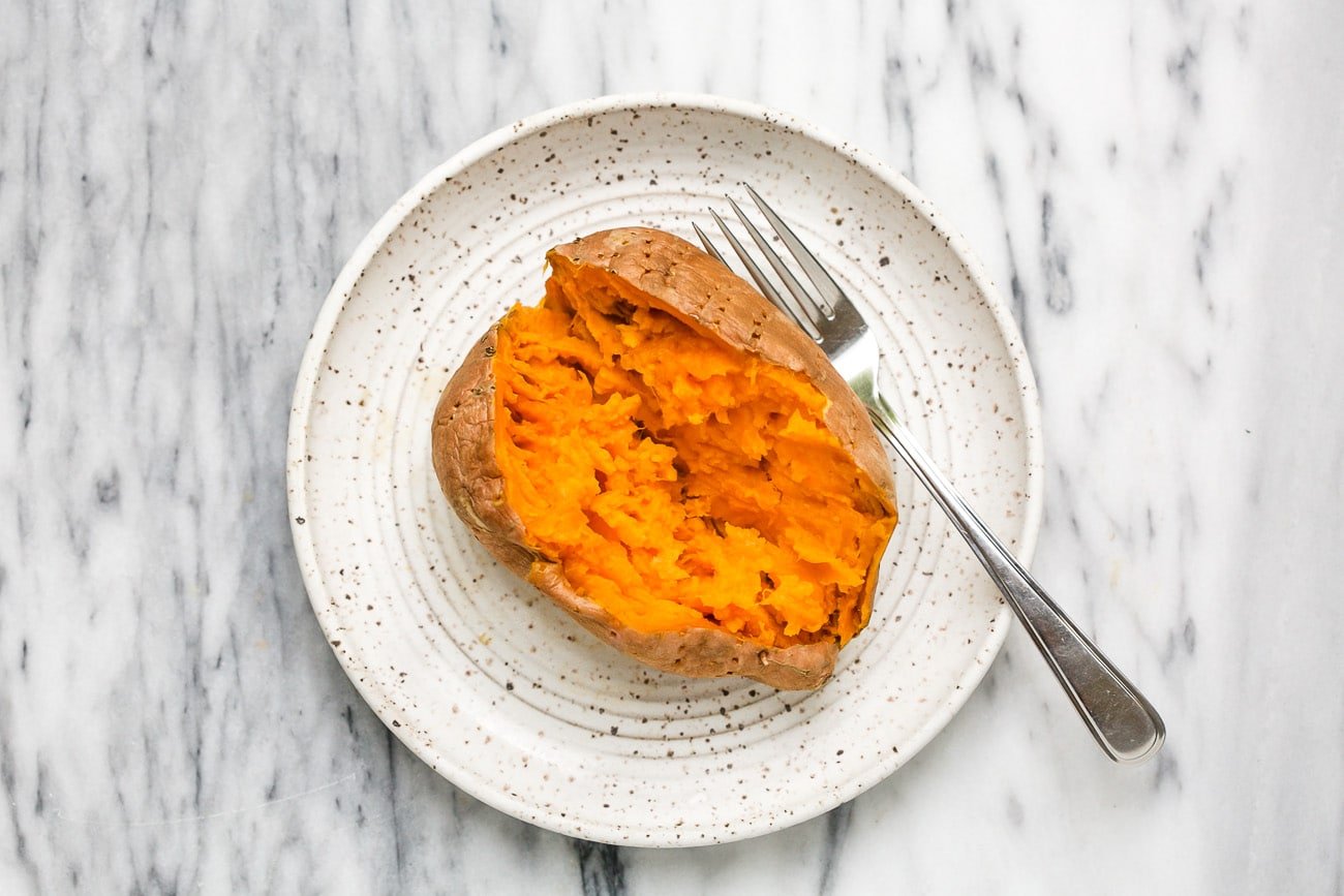 cooked sweet potato on a plate.