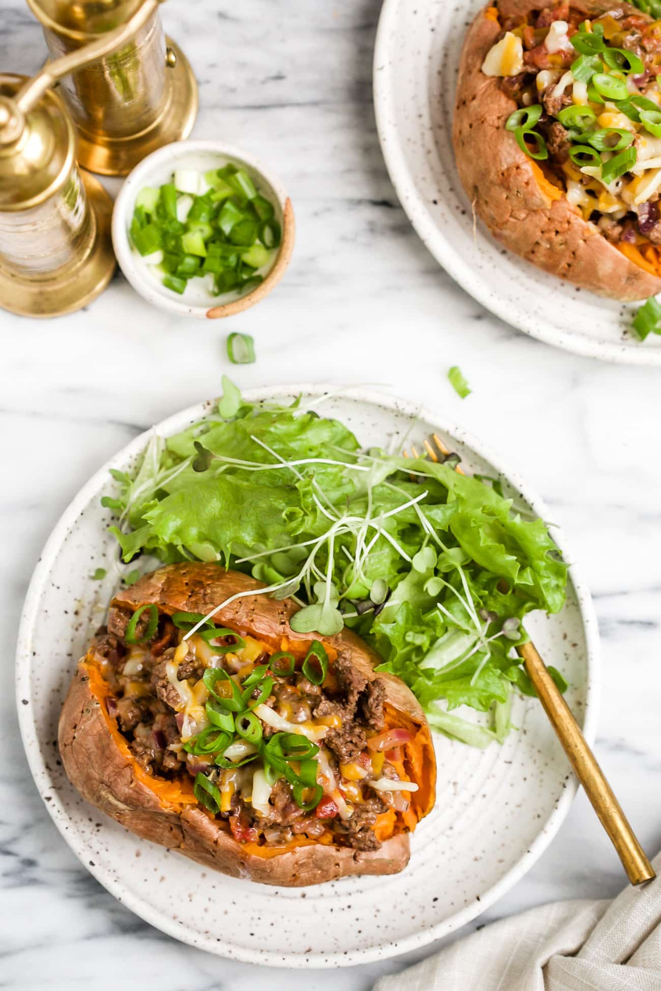 overhead view of stuffed sweet potato on a white plate