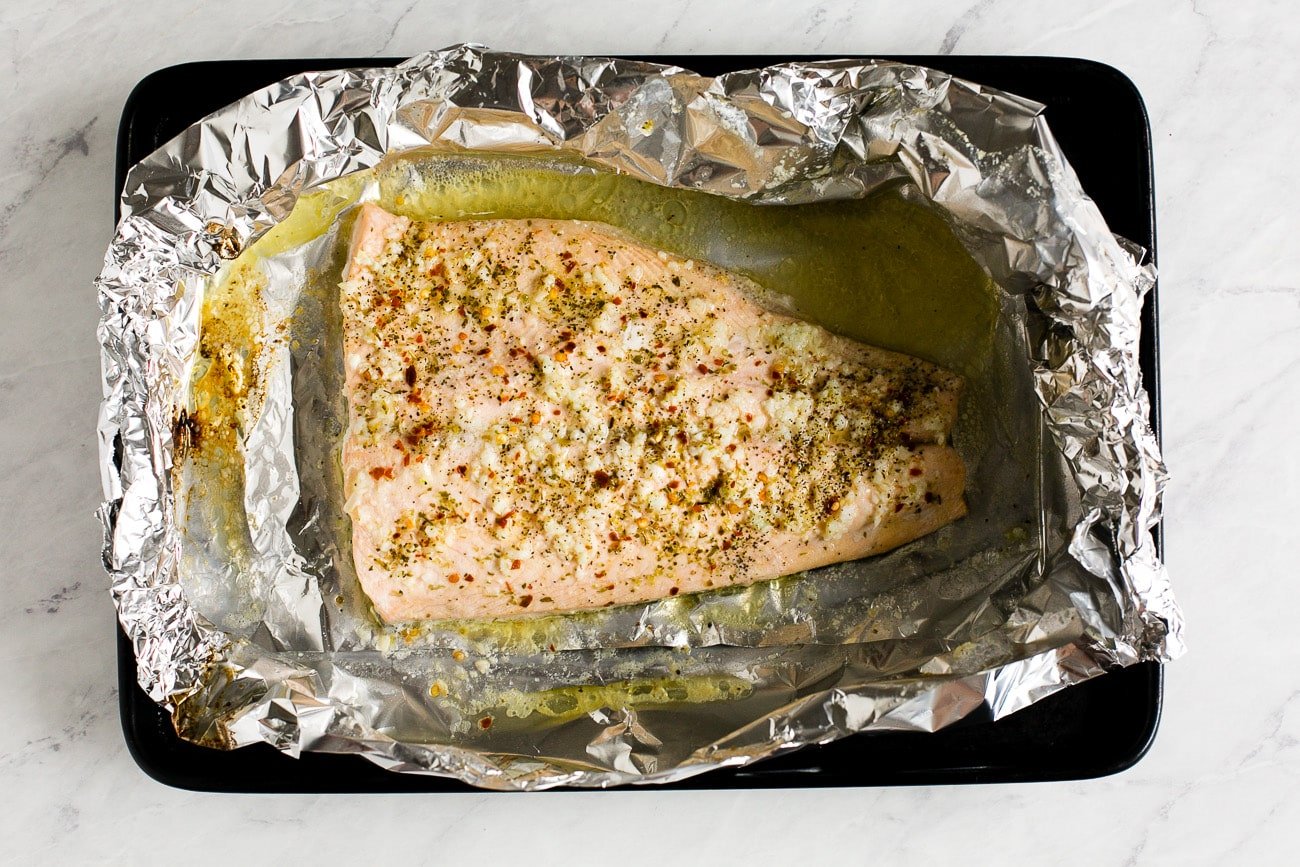 overhead view of cooked salmon in a foil