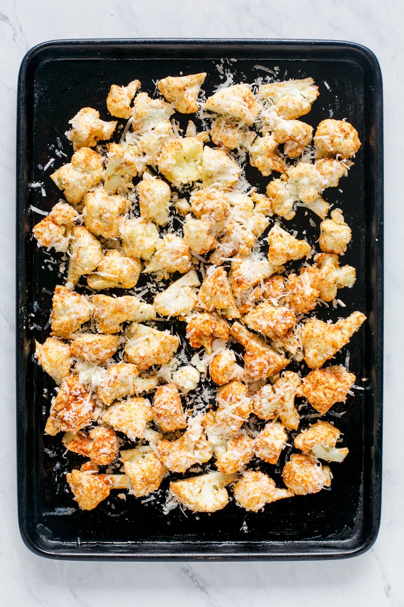 overhead view of cauliflower in a baking sheet