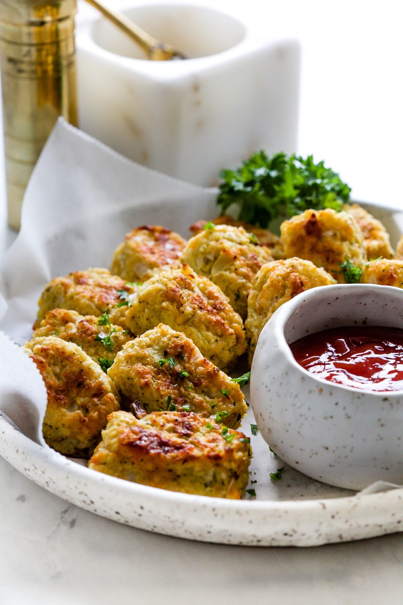 closeup view of cauliflower tots in a white plate