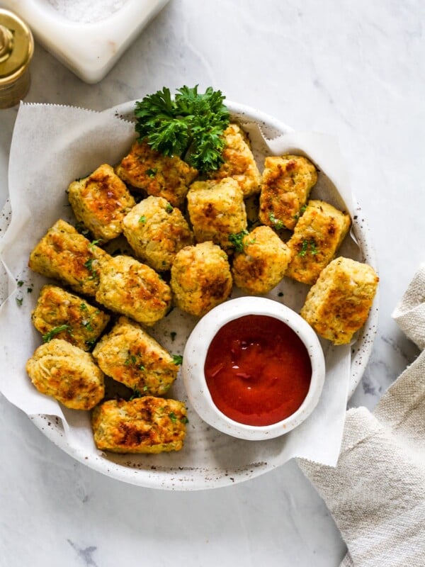 overhead view of cauliflower tots on a white plate