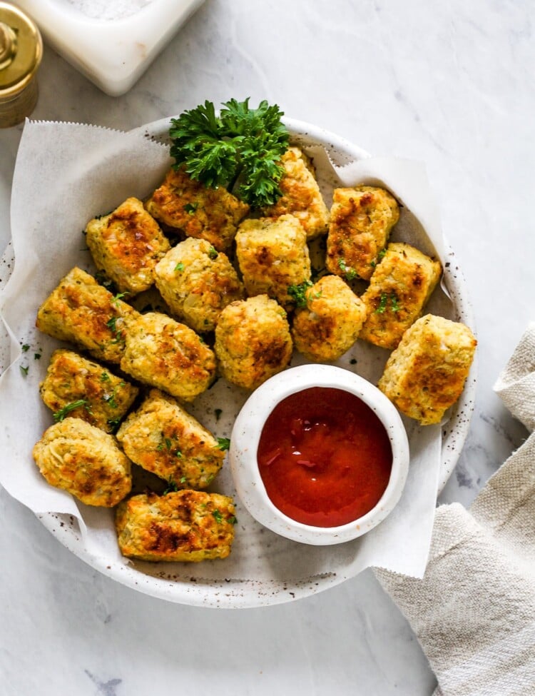 overhead view of cauliflower tots on a white plate