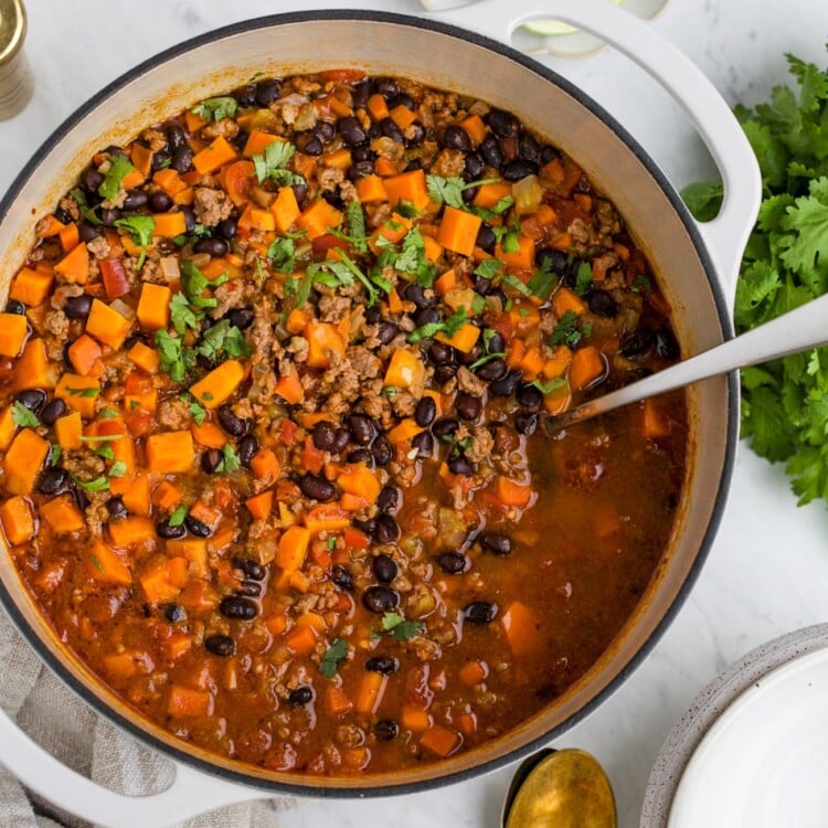 Overhead view of a pot containing sweet potato chili