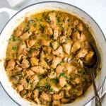 overhead view of chicken stroganoff in a braiser white pan.
