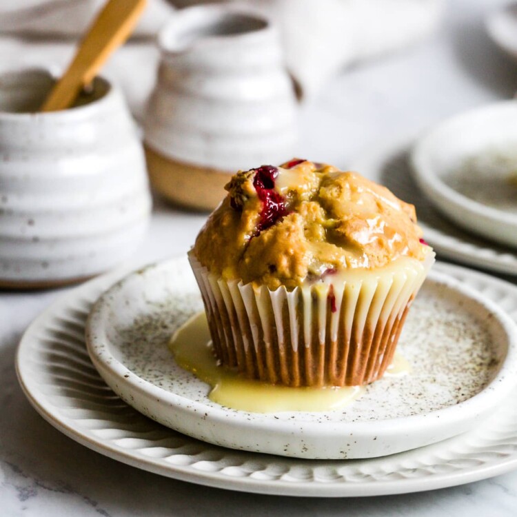 closeup of cranberry muffins in a white small plate