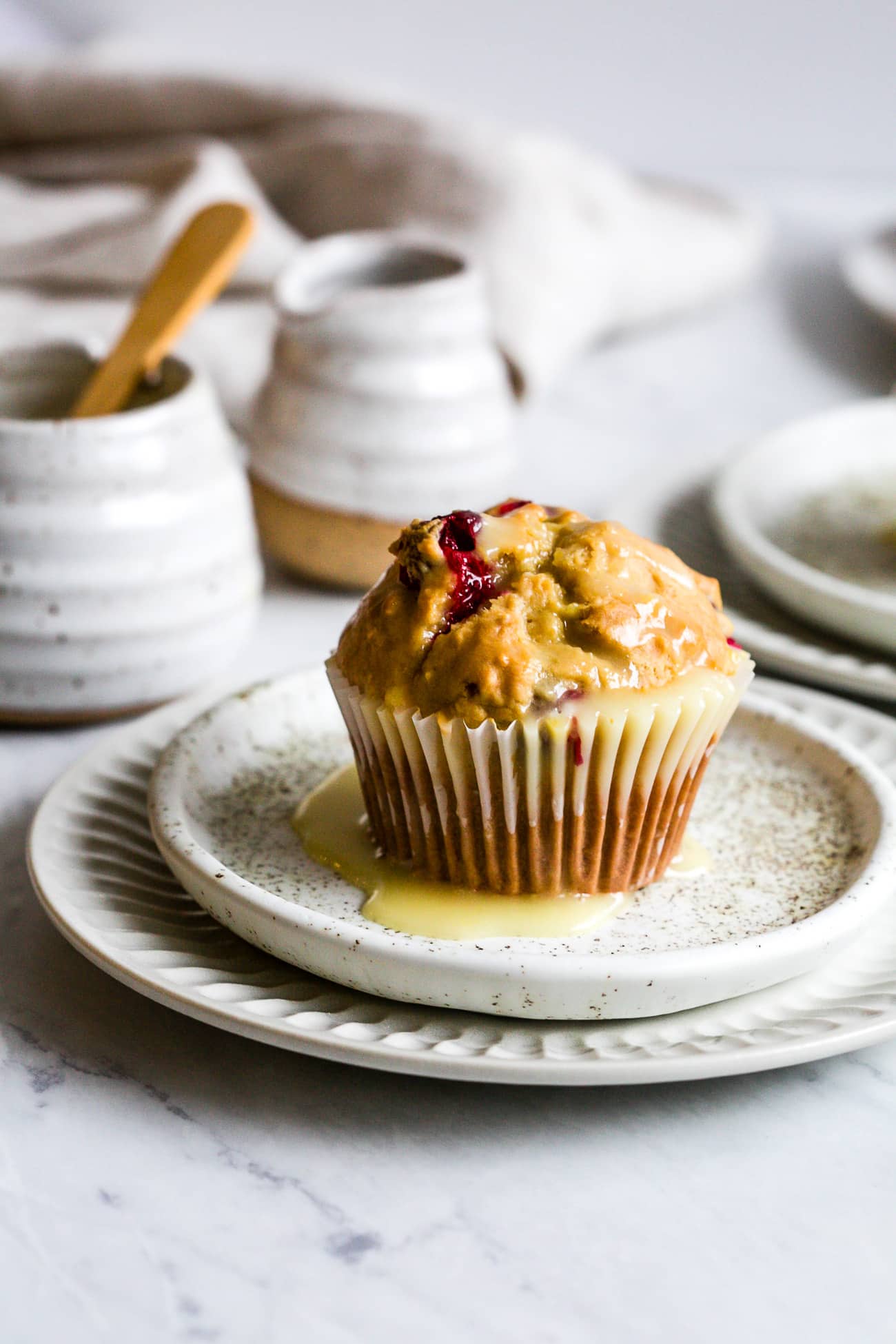 closeup of cranberry muffins in a white small plate