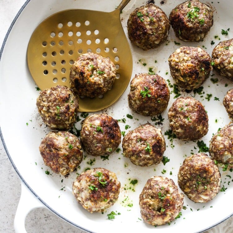 Overhead view of Turkey meatball in a white skillet