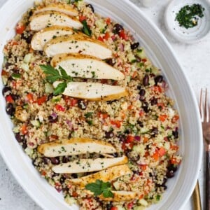 Chicken quinoa salad in a large, white serving dish.