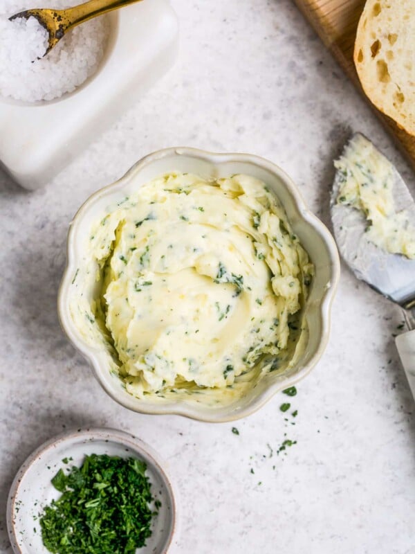 overhead view of garlic butter in a small white bowl