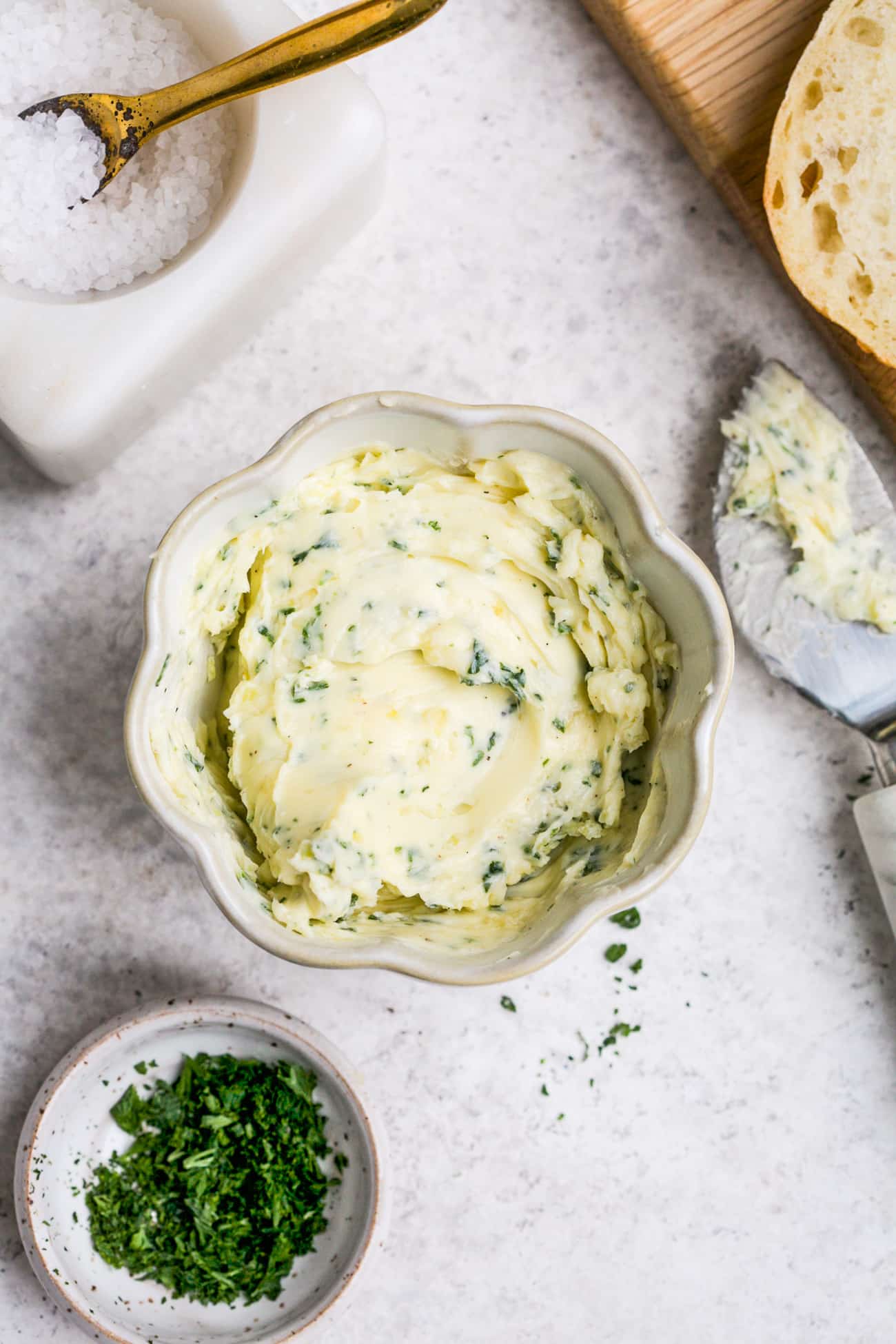 Garlic butter in a small, white bowl. 