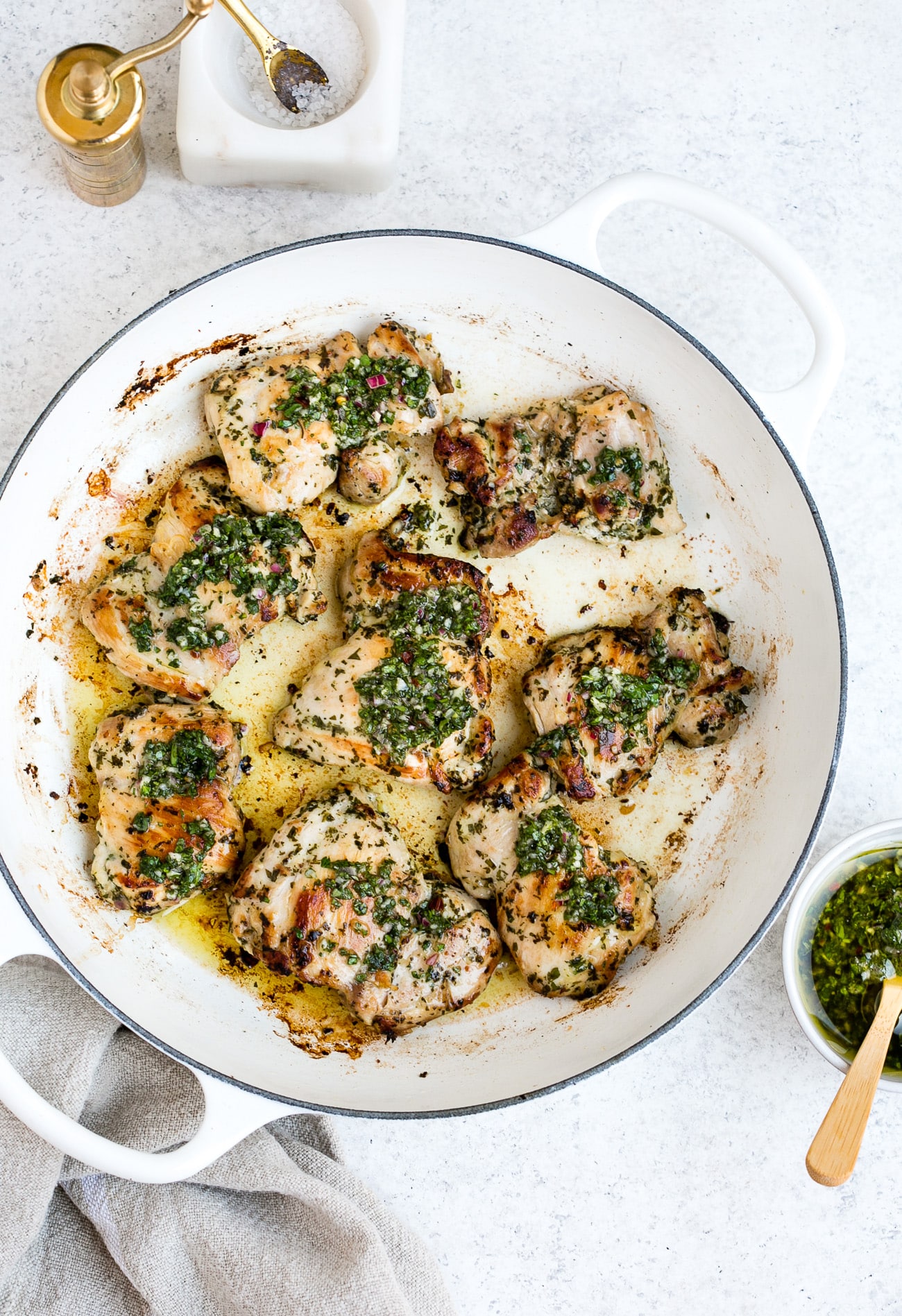 Chimichurri chicken in a large, white skillet.