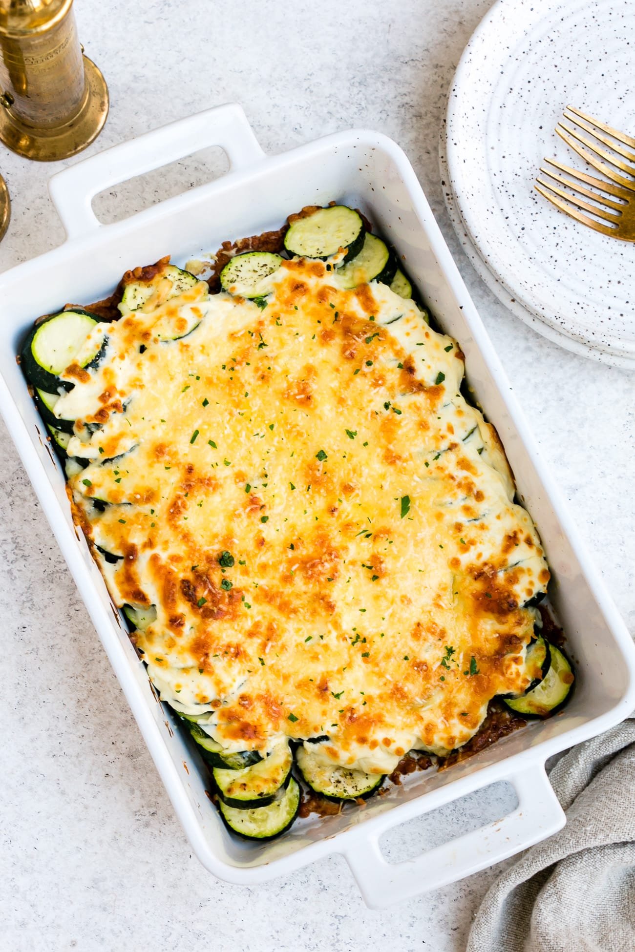 Zucchini casserole in a large, white baking dish.