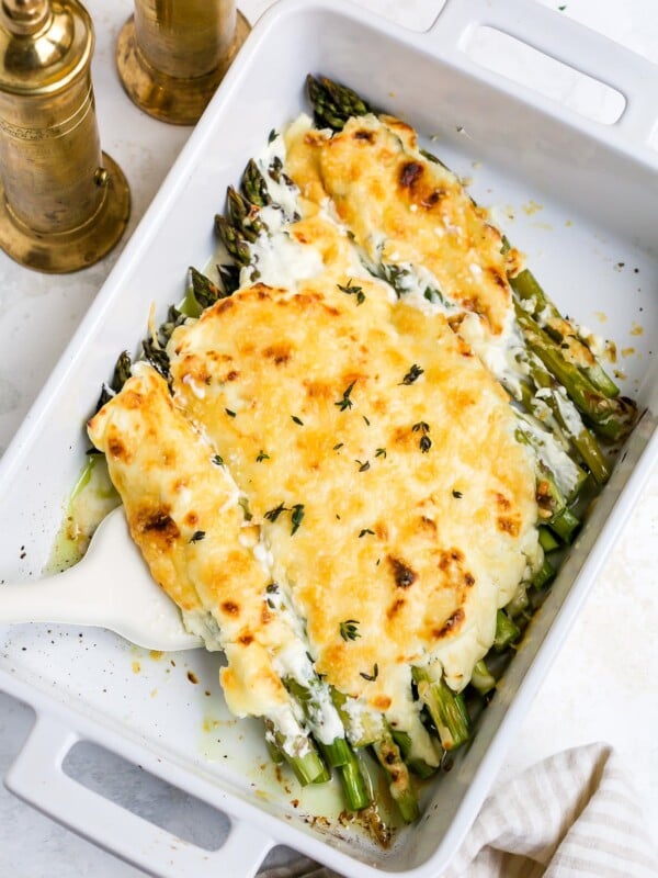 Asparagus casserole in a white baking dish.