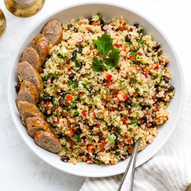 Quinoa salad in a large, white serving bowl.