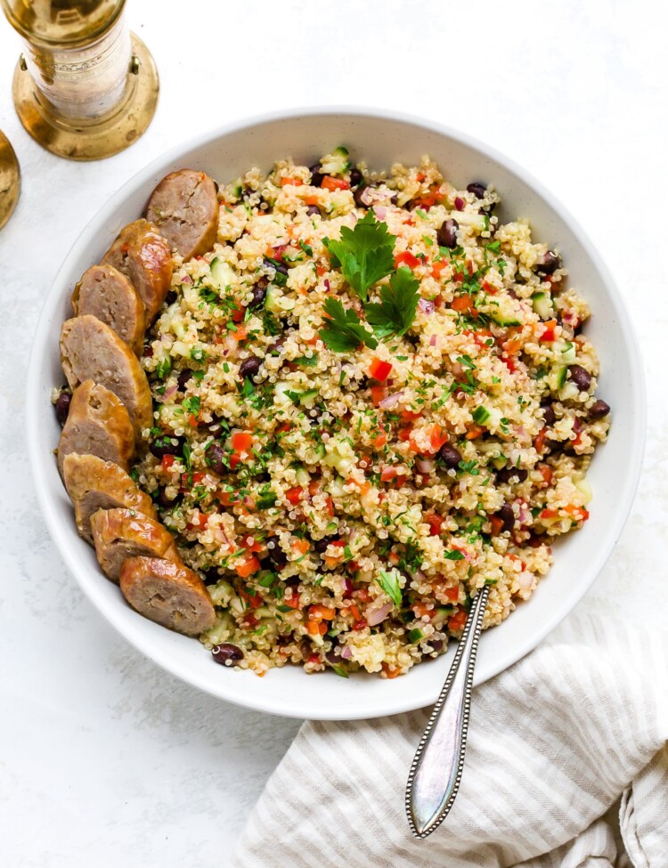 Quinoa salad in a large, white serving bowl.