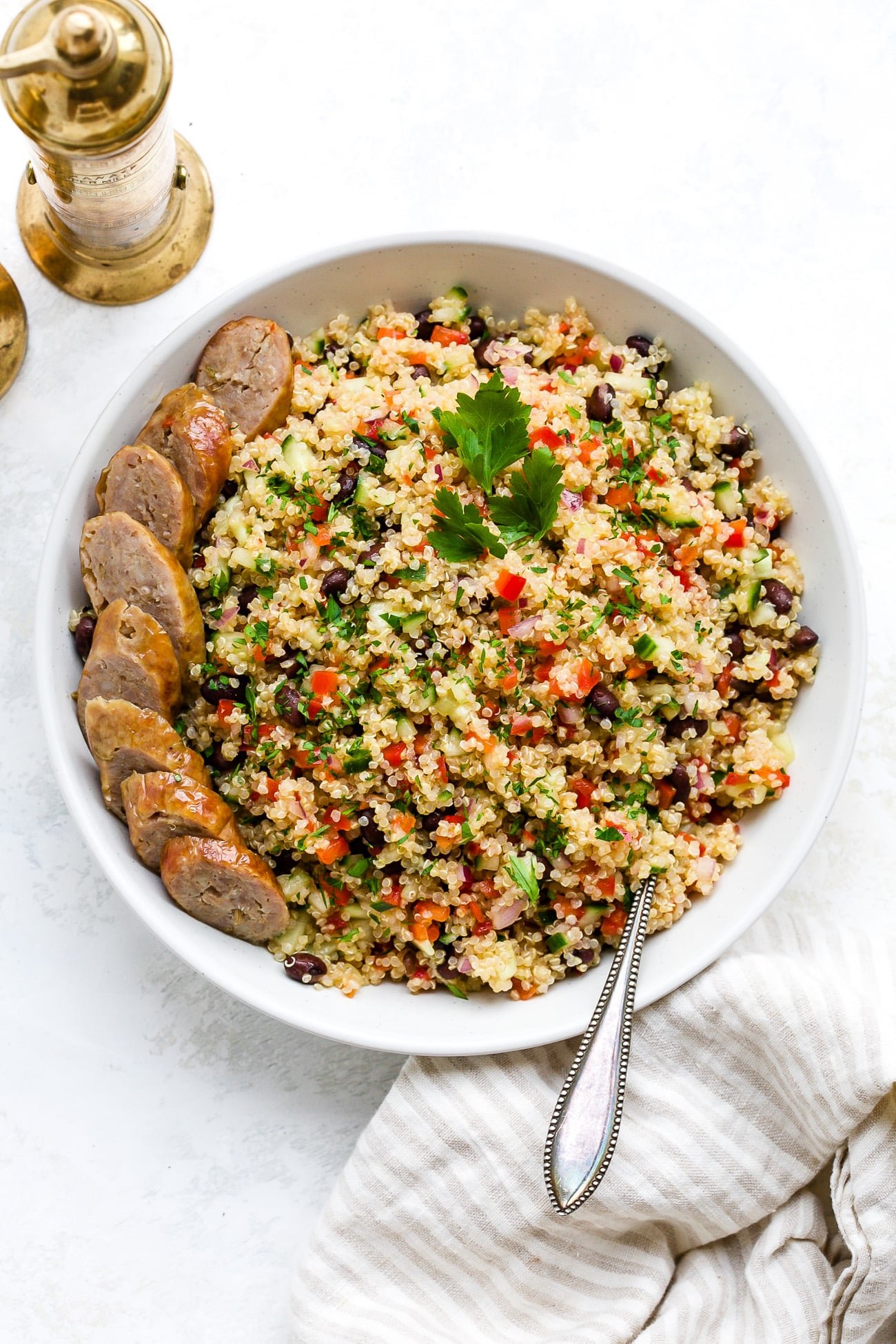 Quinoa salad in a large, white serving bowl.