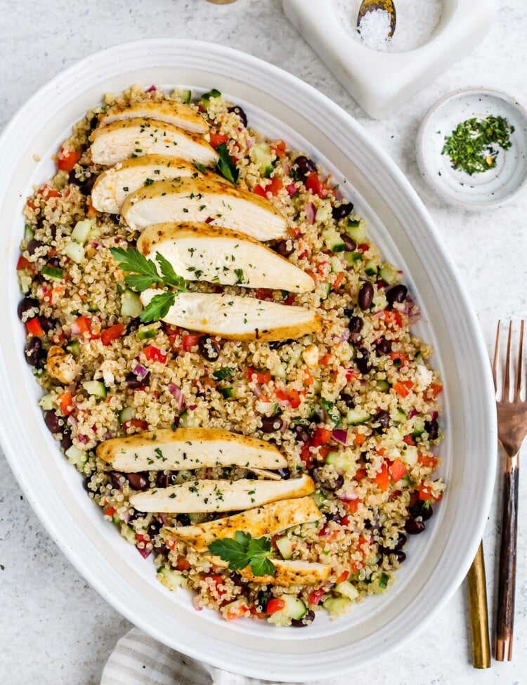 Chicken quinoa salad in a large, white serving dish.
