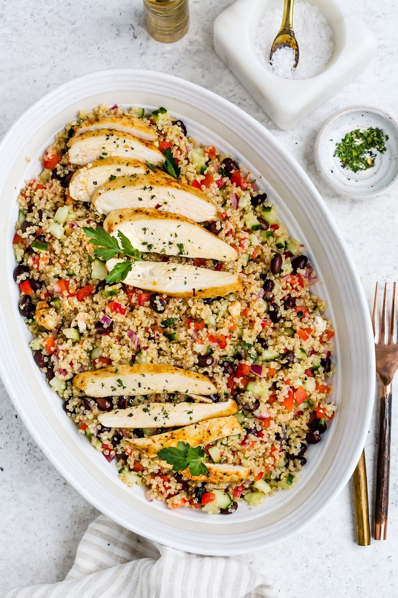 Chicken quinoa salad in a large, white serving dish.