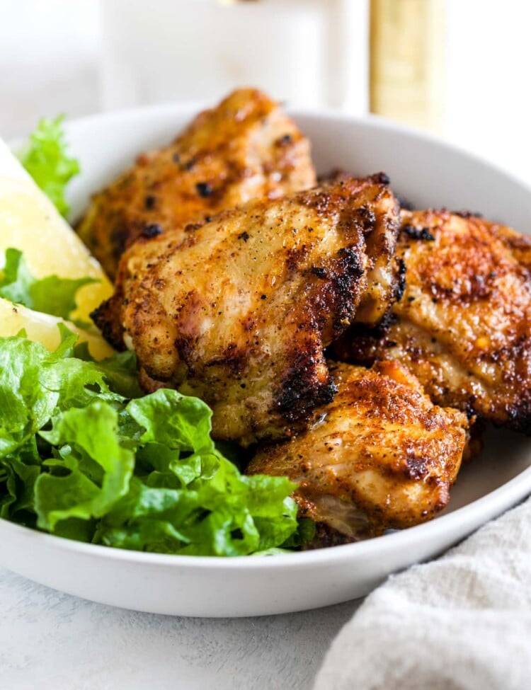 Grilled Chicken Thighs in a white bowl