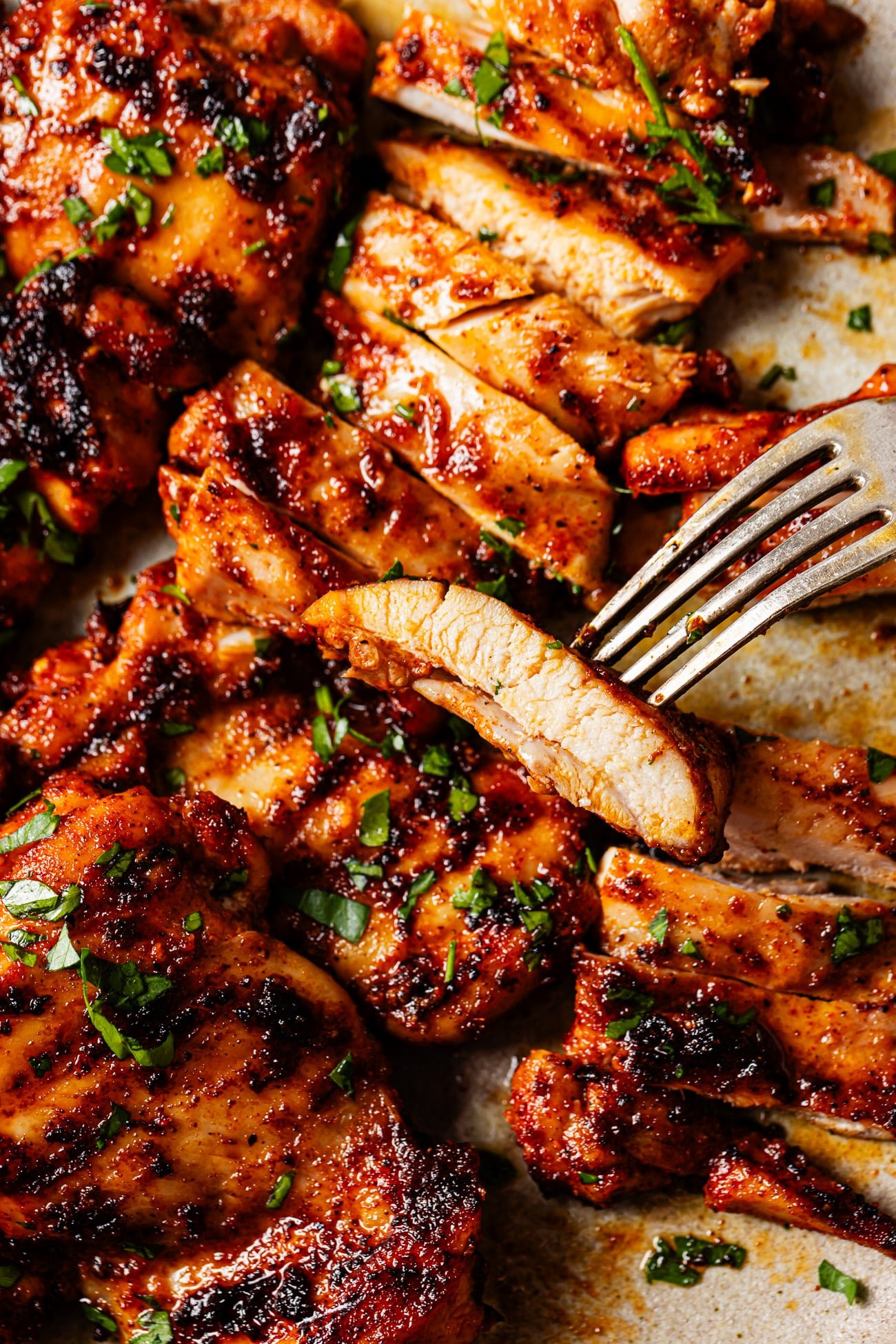 Close-up of a slice of chicken on a fork