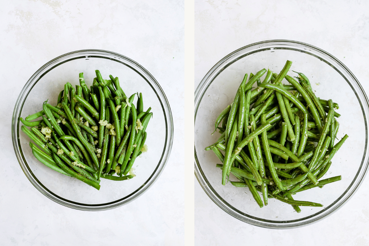 Seasoning green beans in a large mixing bowl. 