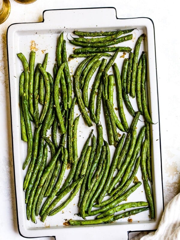 Roasted green beans on a baking sheet.