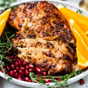 closeup view of an air fryer turkey breast in a white plate