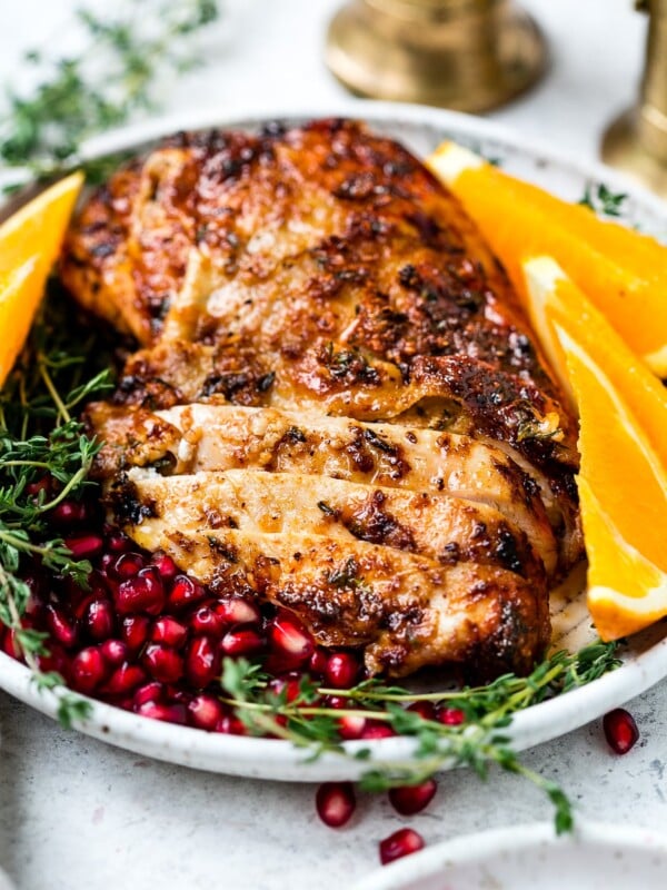 closeup view of an air fryer turkey breast in a white plate
