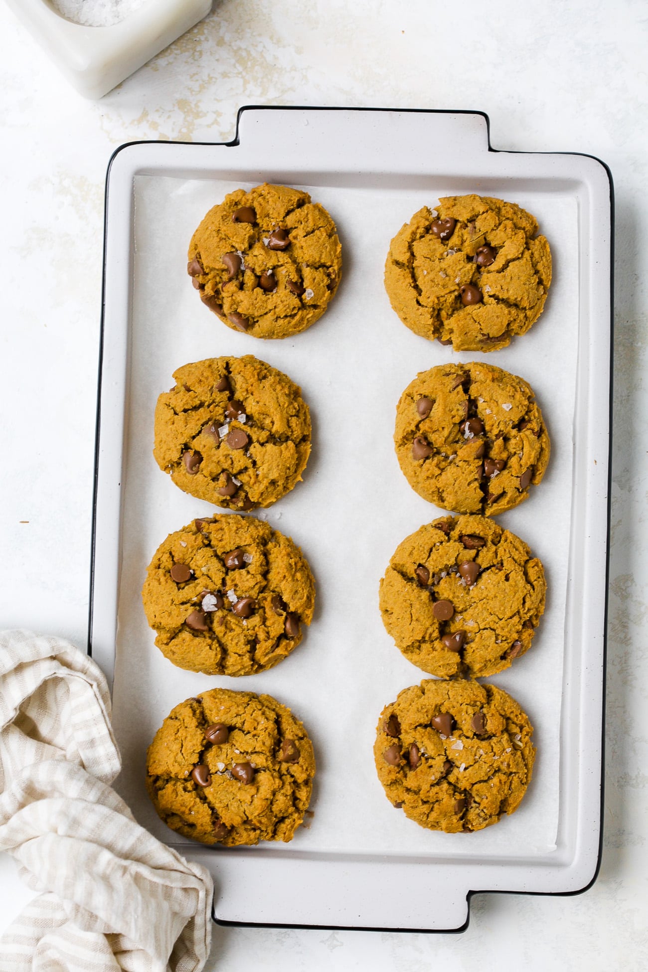Gluten-free pumpkin chocolate chip cookies on baking sheet. 