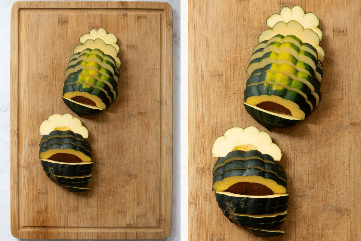 acorn squash sliced on a wooden cutting board.
