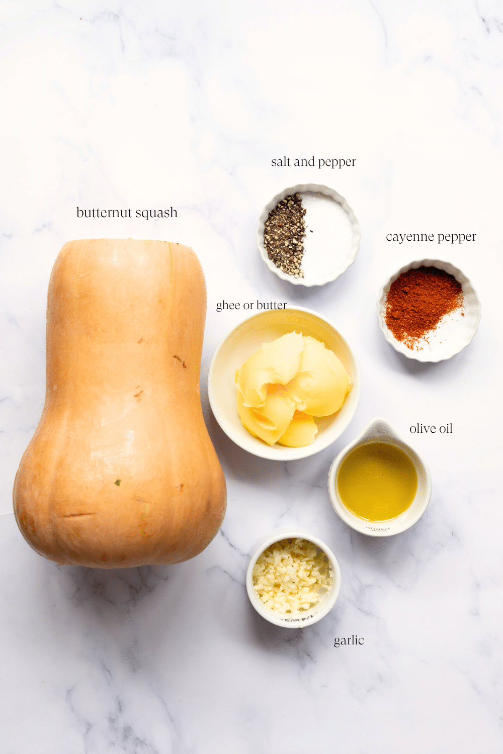 ingredients to make mashed butternut squash on a marble countertop.