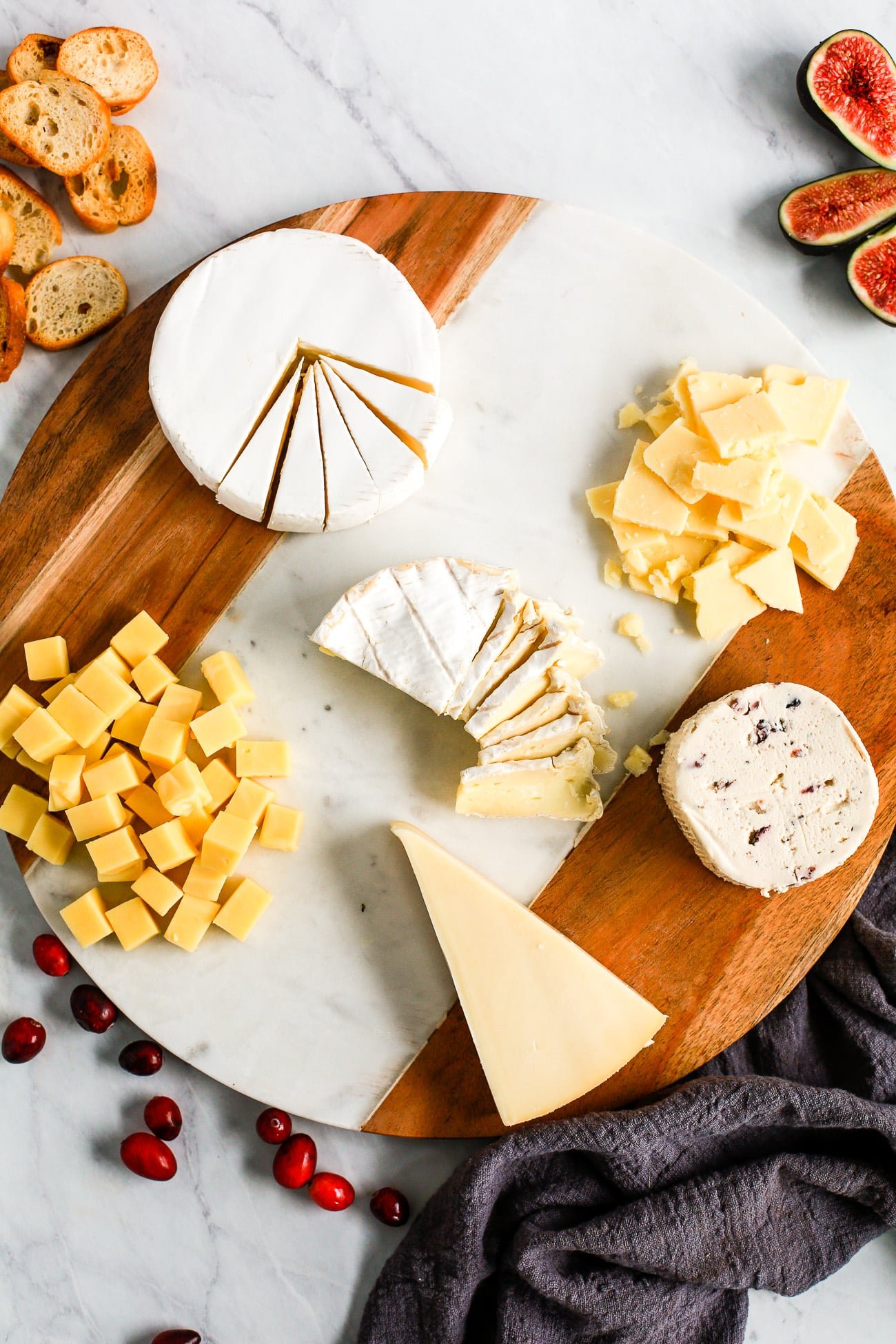 different type of cheese on a marble board