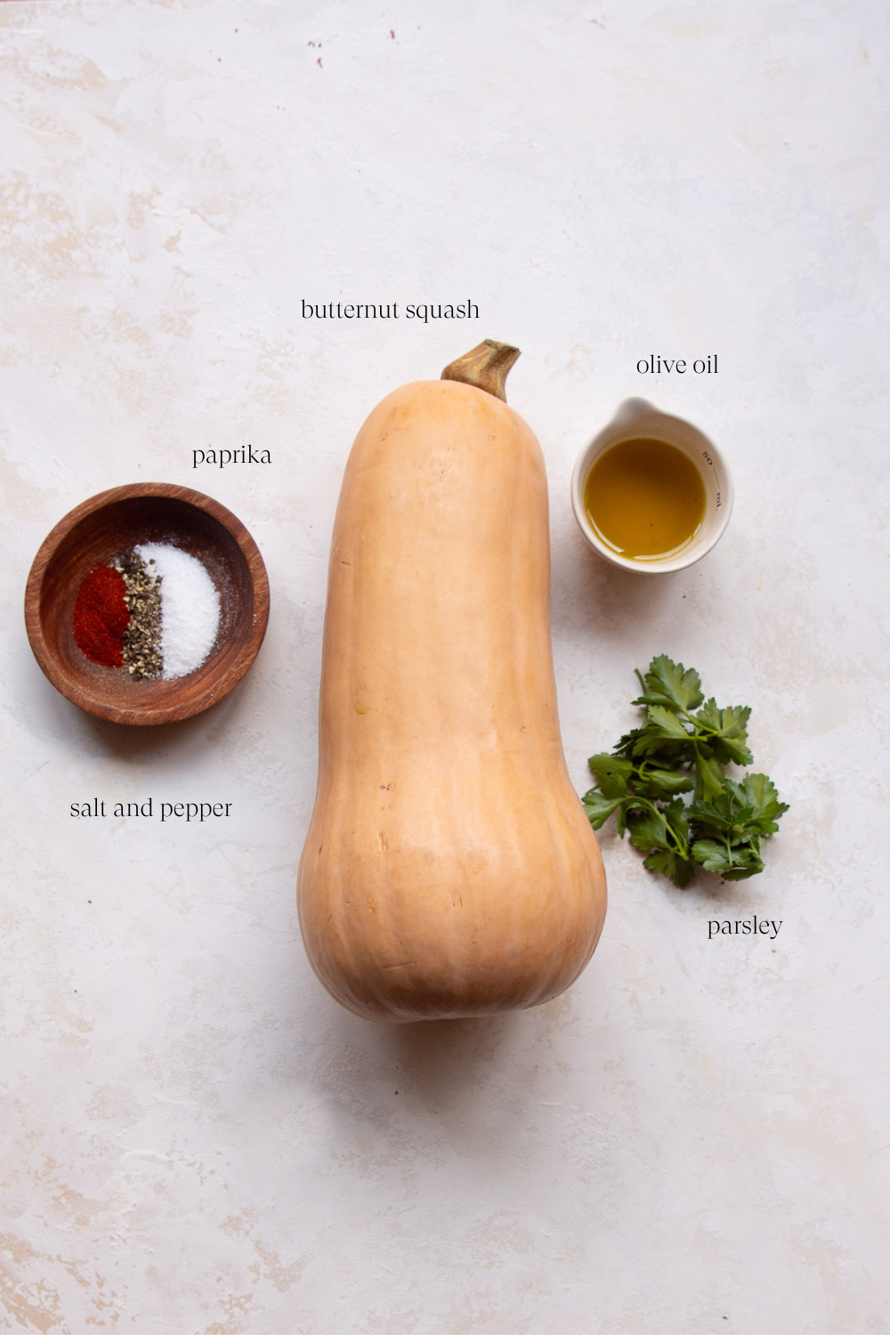 ingredients to make roasted butternut squash on a countertop