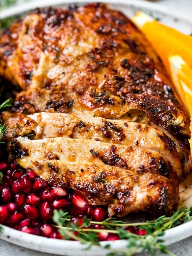 closeup view of an air fryer turkey breast in a white plate