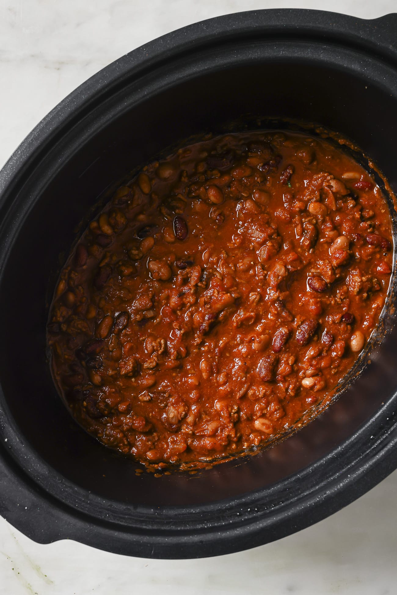 Close up of chili in a slow cooker.