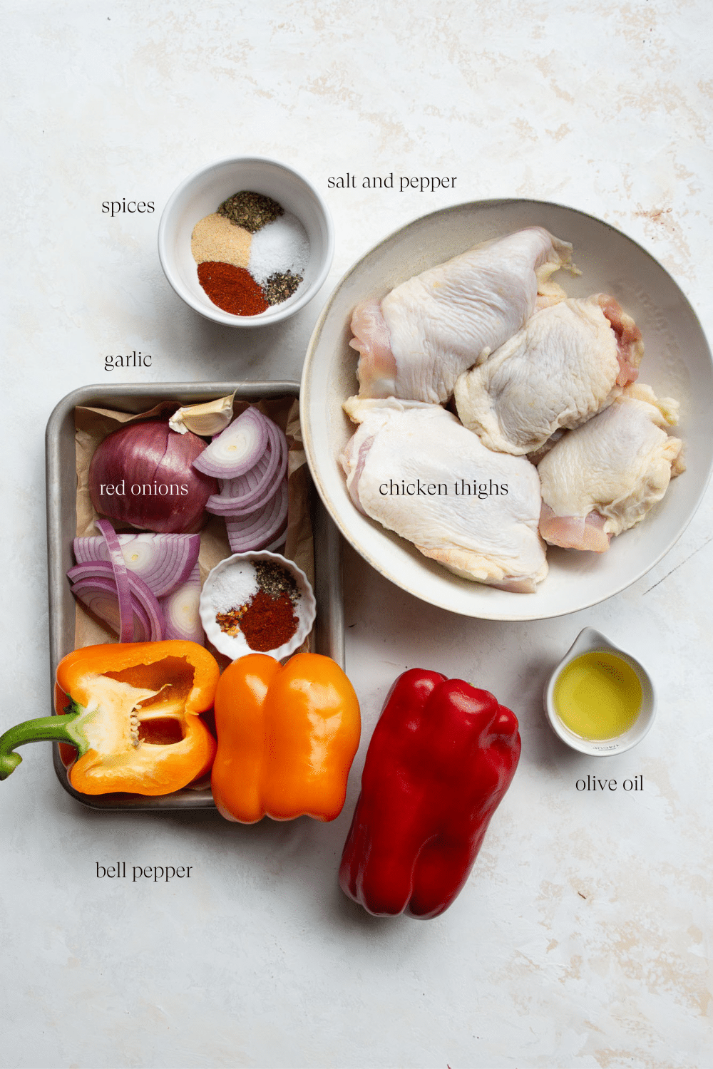 ingredients on the countertop to make chicken thighs and peppers.