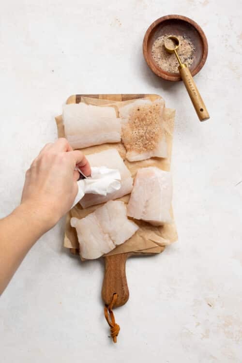 raw cod on a wooden board