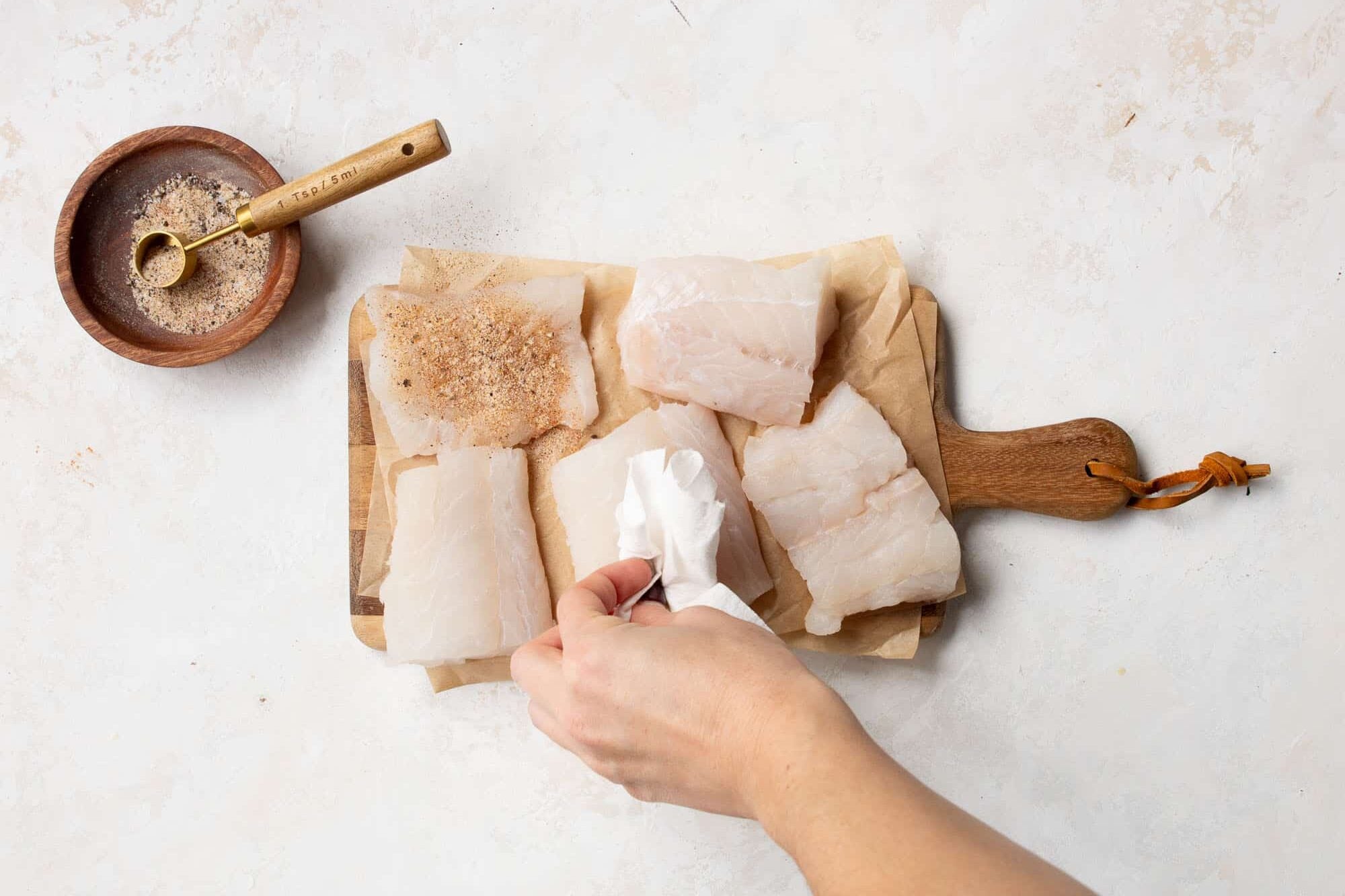 raw cod on a wooden board