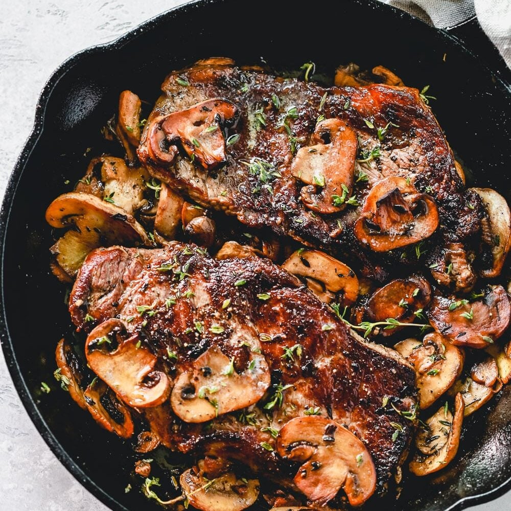 Pan Seared Steak with Mushrooms over head view.