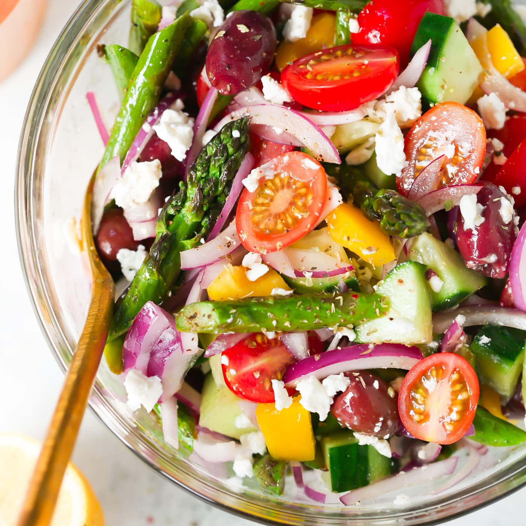 Asparagus Greek chopped salad in a bowl.