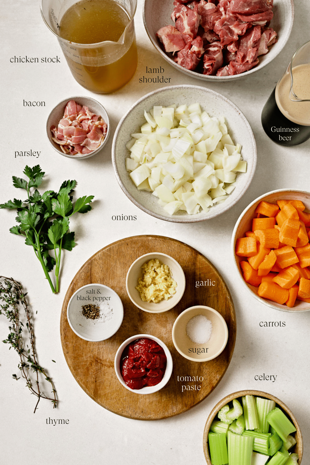 Pre-measured ingredients in small bowls on a white countertop. 