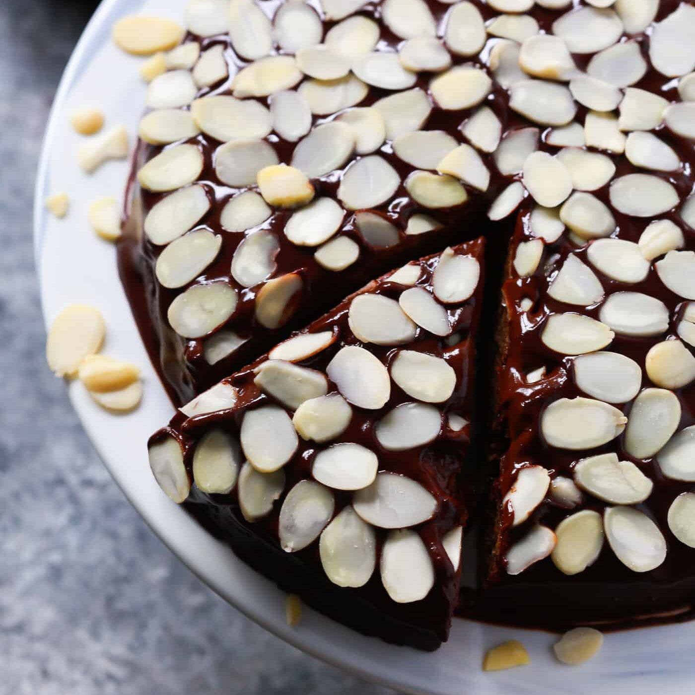 low-carb almond flour chocolate cake with sliced almonds on top.