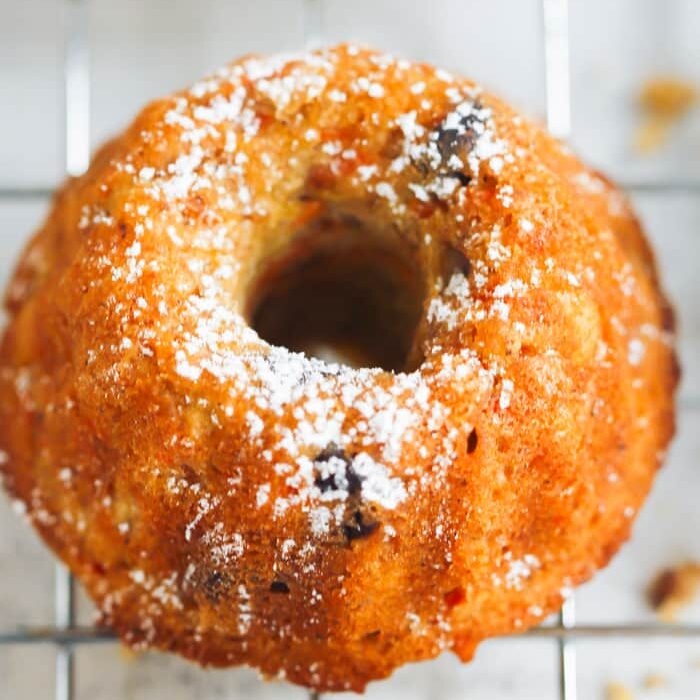 Closeup of a carrot Bundt cake with powdered sugar. 