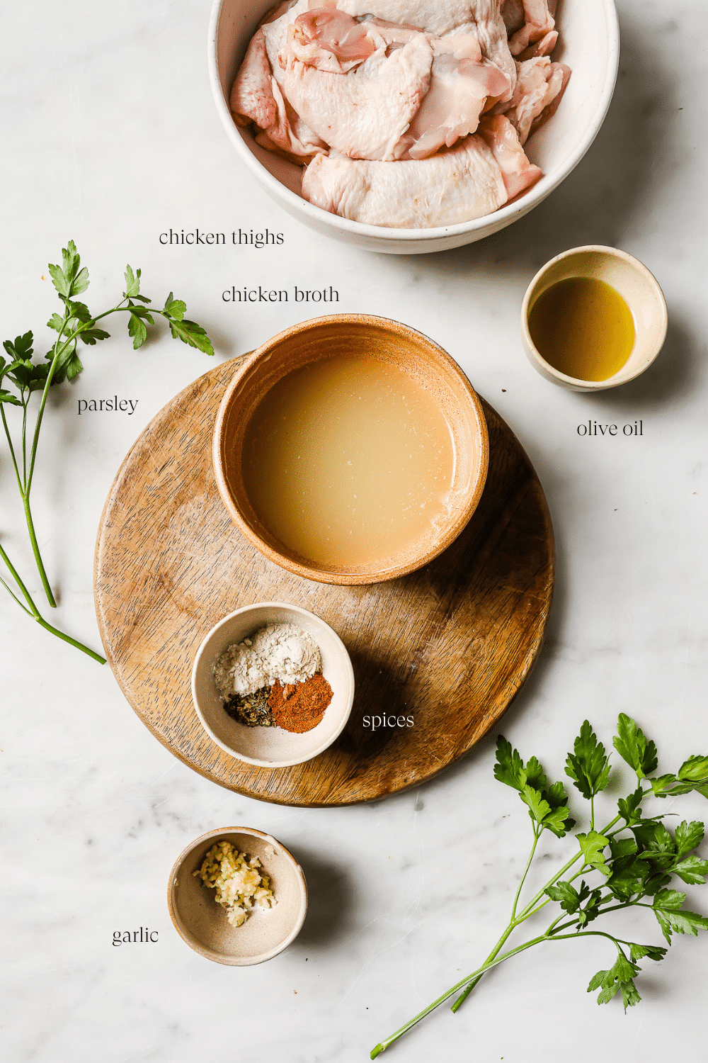 Small bowls of pre-measured ingredients against a white background.