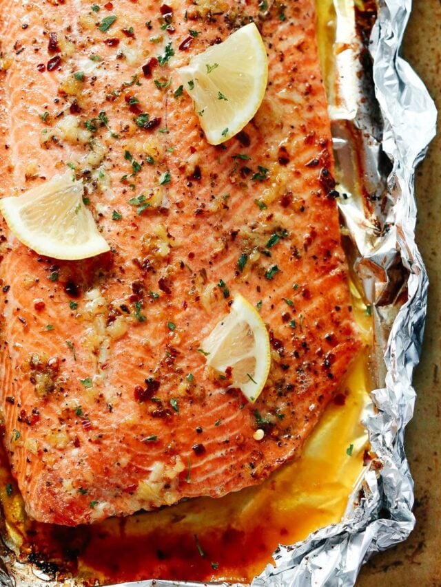 overhead view of baked salmon in a baking sheet