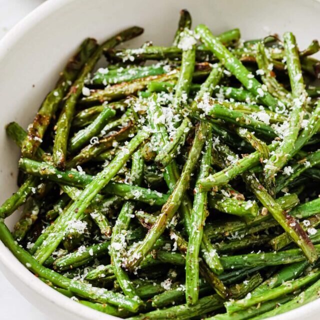 Parmesan Green Beans in a white serving dish. 